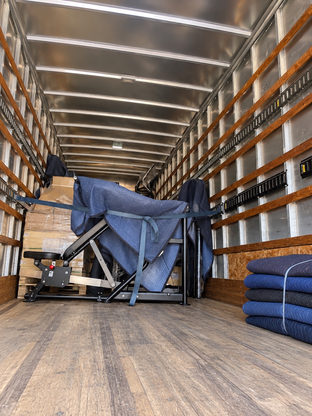 Blanket-protected furniture secured inside the box truck